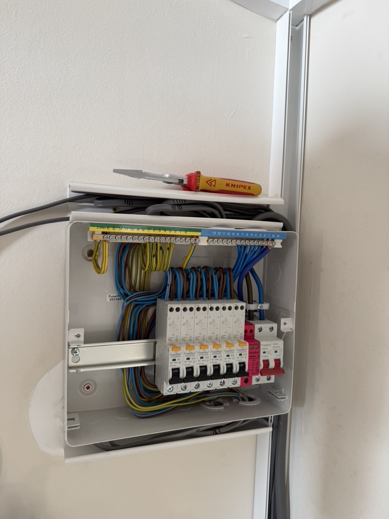 Consumer unit repair with neat coloured wiring by Grid and Glow