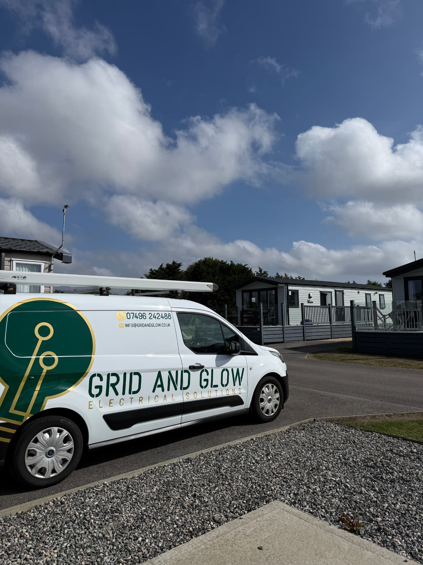 Grid and Glow van parked at a Cornish holiday park during an EV charger installation