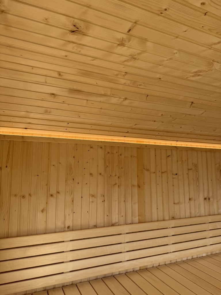 LED strip lighting installed in a timber-clad sauna